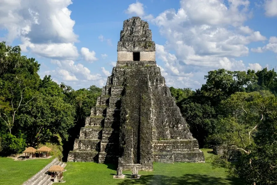 Tall Maya temple rising above the rainforest at Tikal National Park